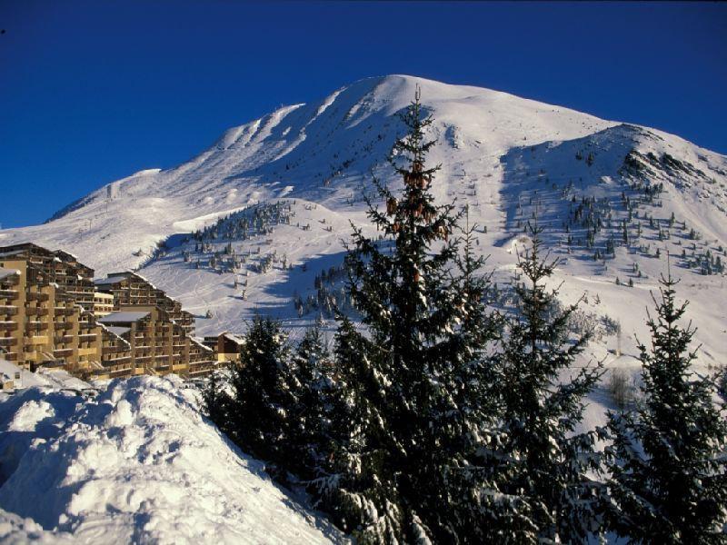 Holiday in mountain resort Résidence les Gentianes - Auris en Oisans - Winter outside