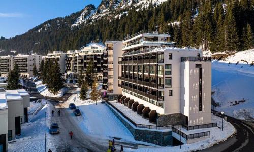 Ski verhuur Résidence Les Terrasses de Véret *** - MH - Flaine - Buiten winter