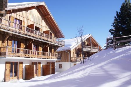 Rent in ski resort Résidence les Chalets des Cimes - La Toussuire - Winter outside