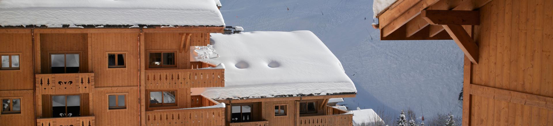Location au ski Résidence le Village de Lessy - Le Grand Bornand - Extérieur hiver