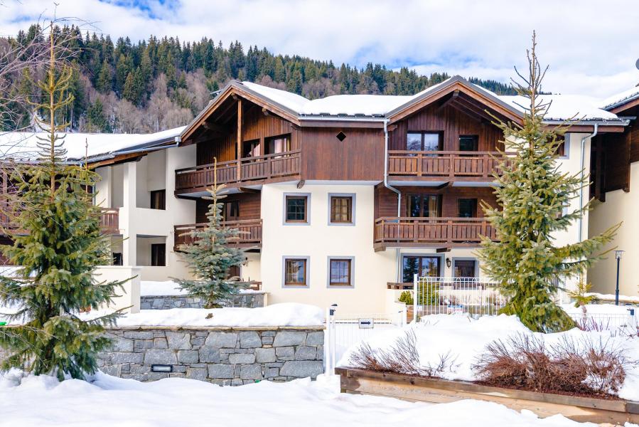 Location au ski Résidence Les Fermes d'Emiguy - Les Gets - Extérieur hiver