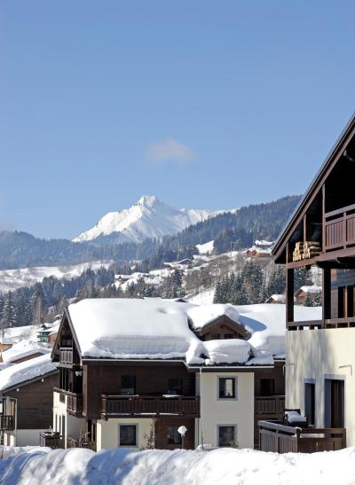 Ski verhuur Résidence Les Fermes d'Emiguy - Les Gets - Buiten winter