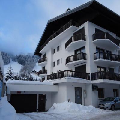 Vacances en montagne Résidence Pied de l'Adroit - Les Gets - Extérieur hiver
