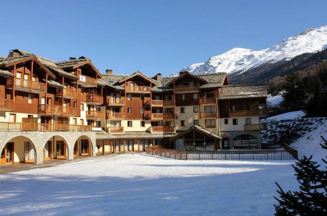 Vacances en montagne Résidence les Alpages - Val Cenis - Extérieur hiver